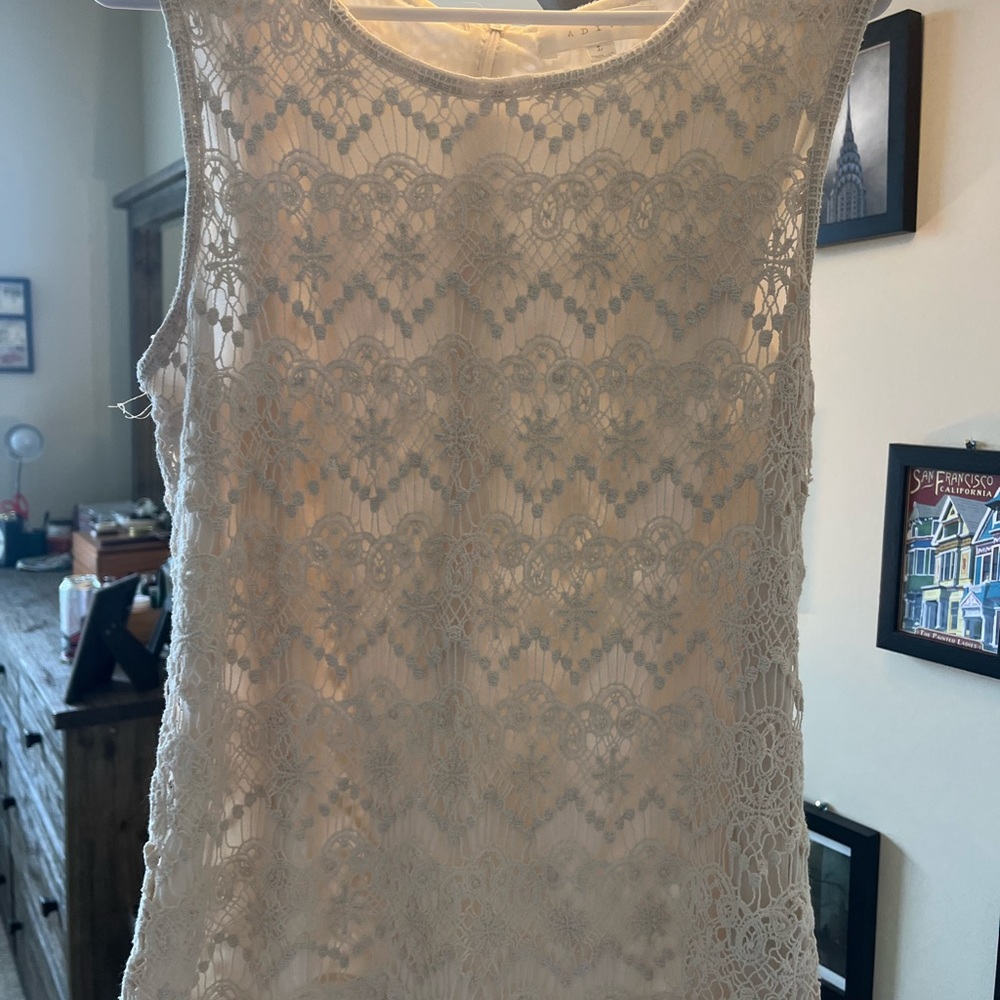 Two sleeveless lacy tanks, size large.